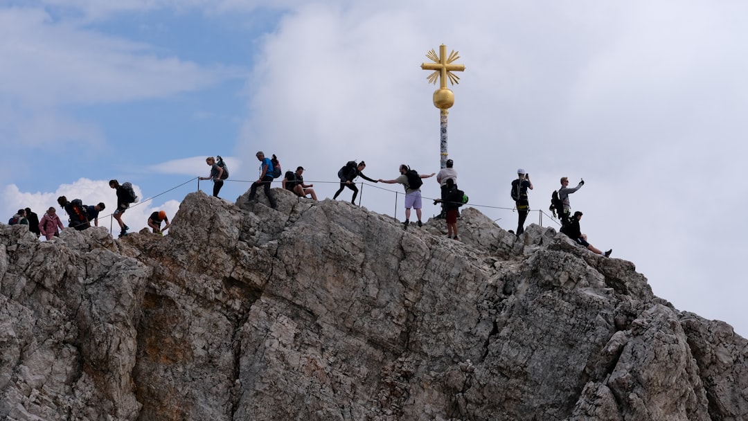 A group of people standing on top of a mountain