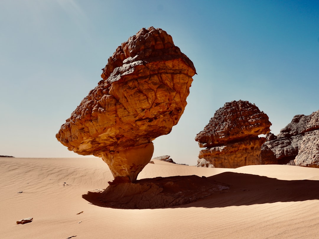 a rock formation in the middle of a desert