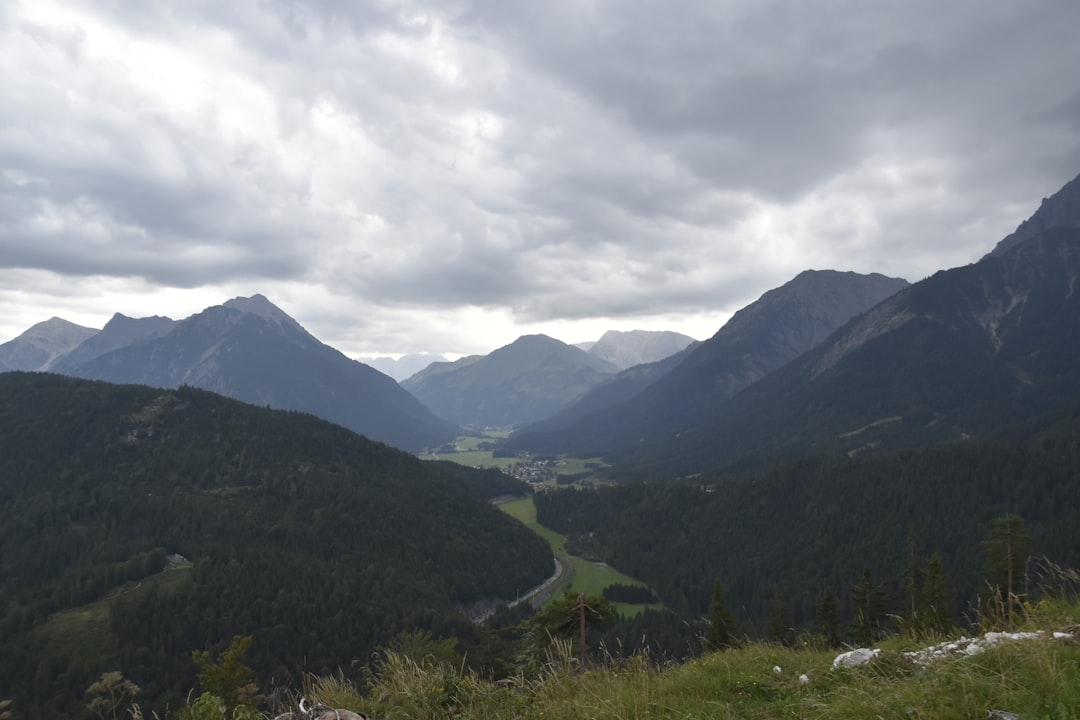 a view of a valley with mountains in the background